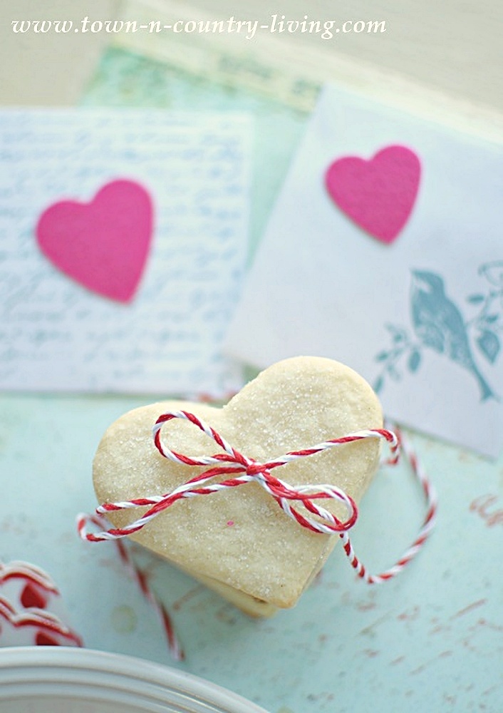 Stack of heart-shaped sugar cookies tied with baker's twine