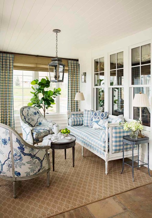 Light blue and white traditional sunroom