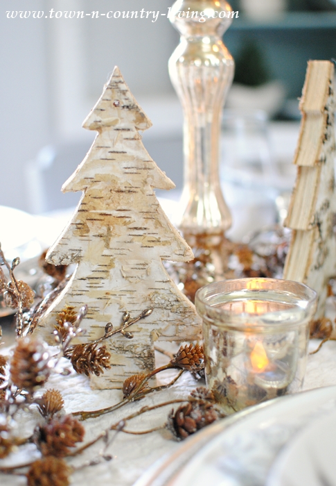 Rustic and Glam Centerpiece using bark-finished trees and bronzed acorns