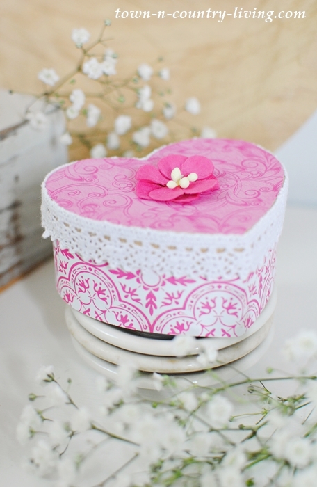 See how to make pretty Valentine boxes from plain brown paper mache forms.