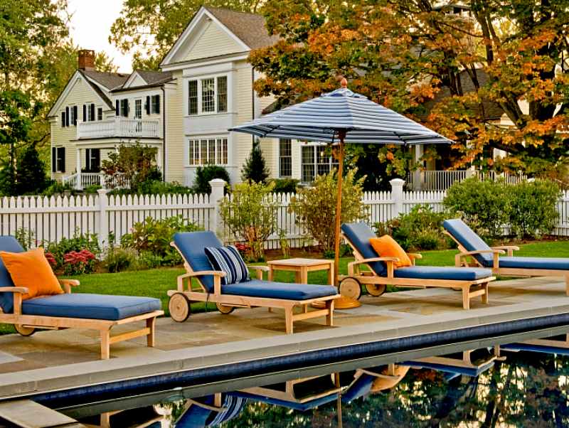 Pool and loungers outside historic home