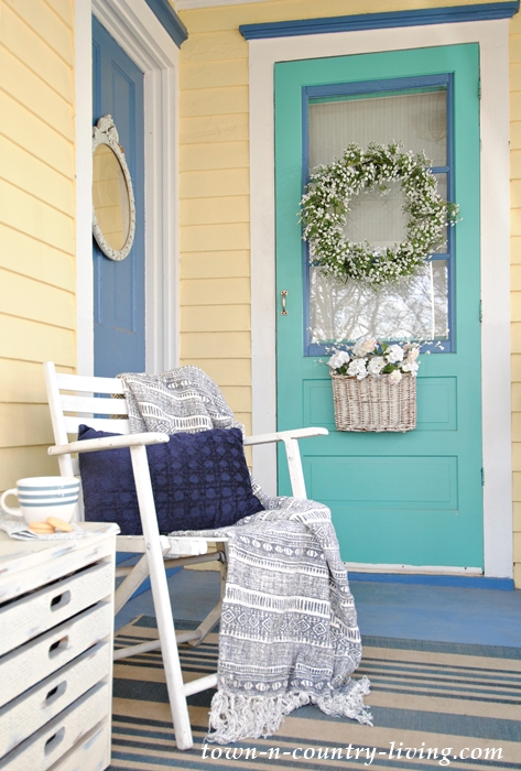 Blue Accents on Yellow Farmhouse Porch