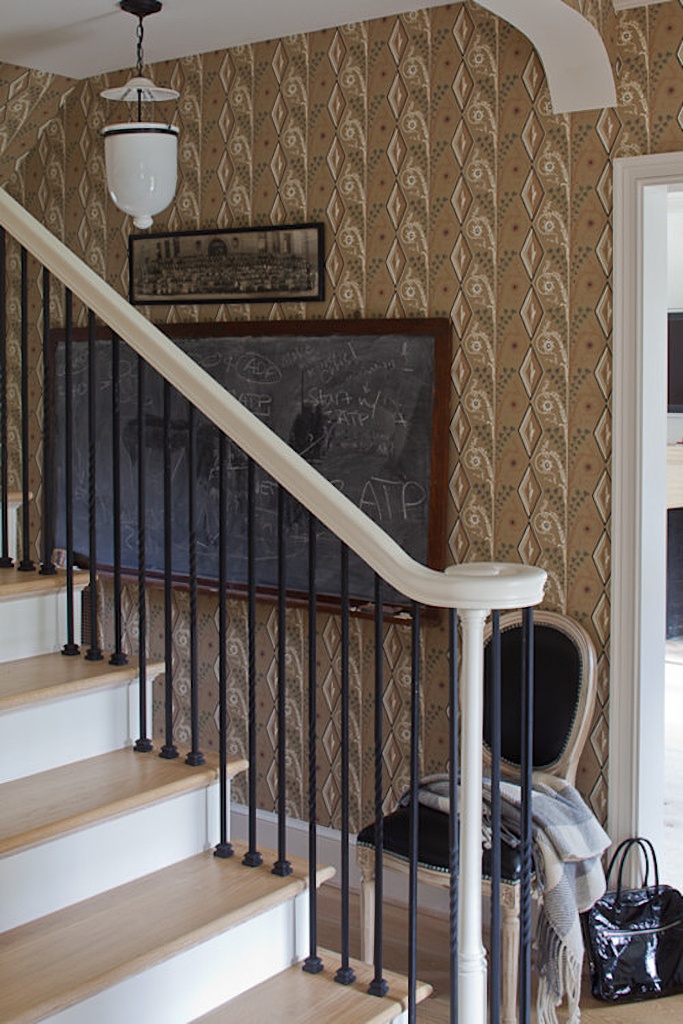 entryway staircase with wallpaper