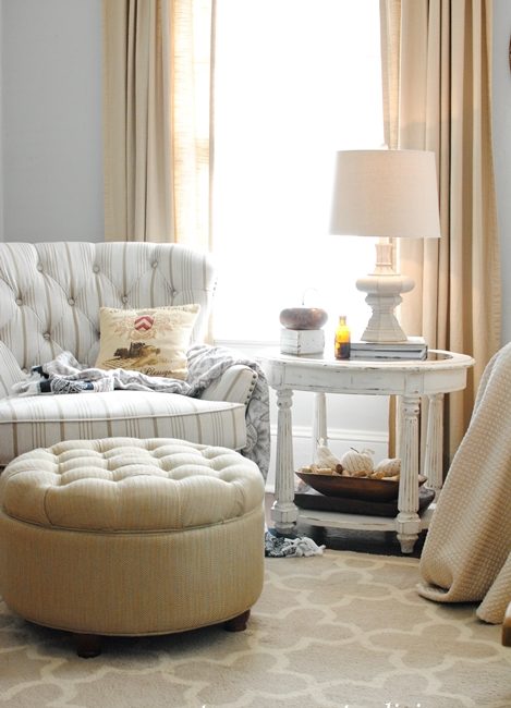 Tufted chair and ottoman in farmhouse family room
