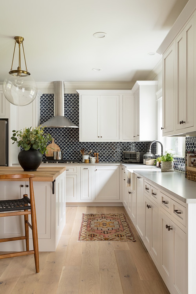 navy blue back splash in white kitchen