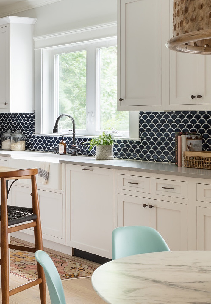 navy blue back splash in white kitchen