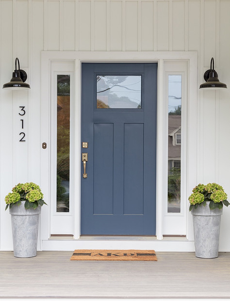 blue front door on eclectic farmhouse