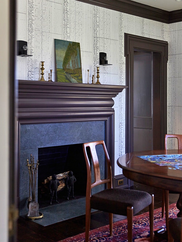 moody dining room with fireplace