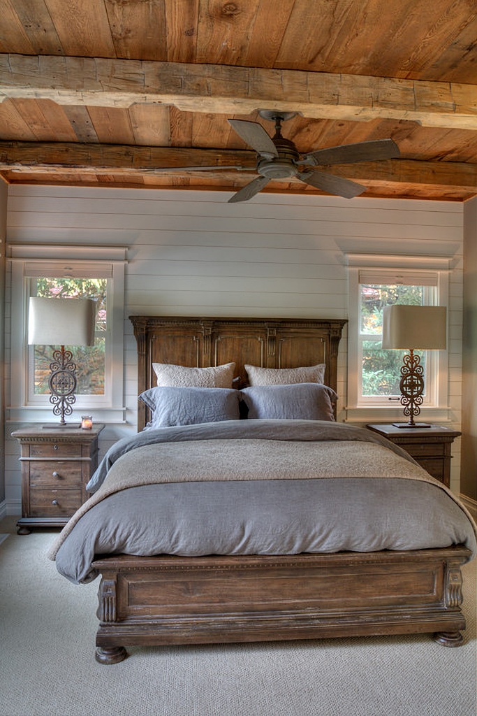 bedroom with wooden ceiling and beams