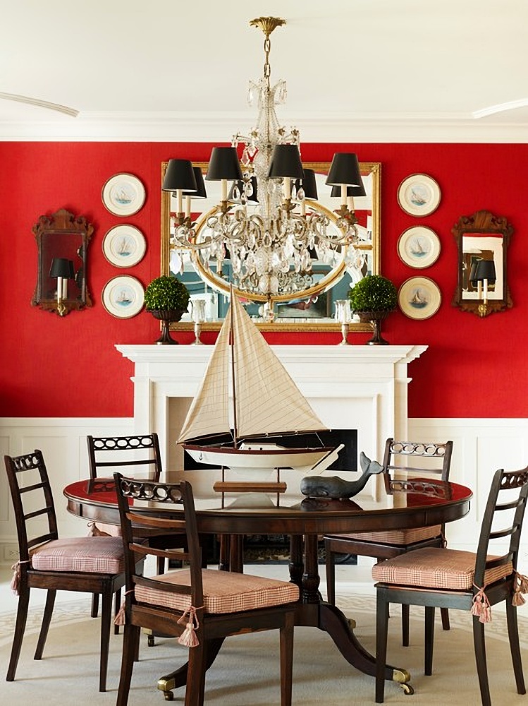 Red dining room with white fireplace