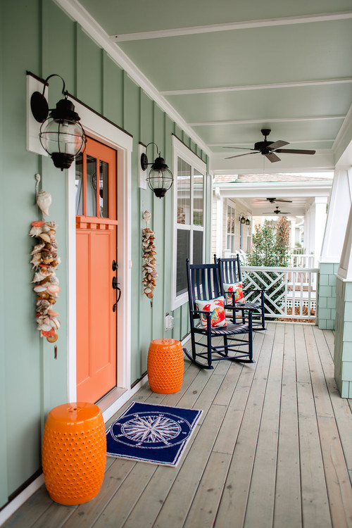Farmhouse Front Porch with Orange Front Door and Accents