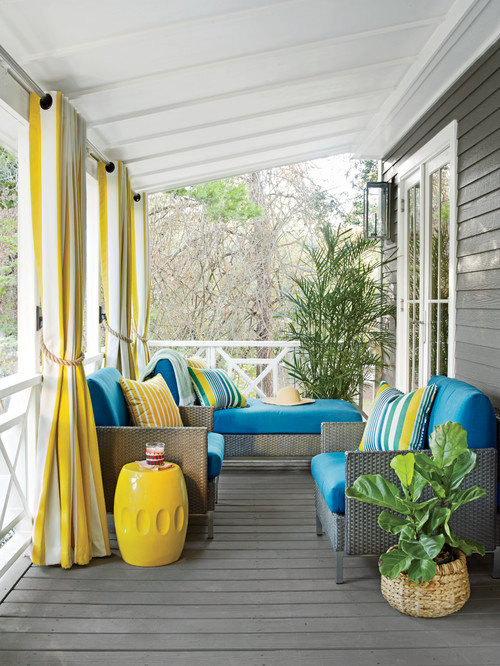 Bright Blue and Yellow Cushions and Pillows on the Front Porch