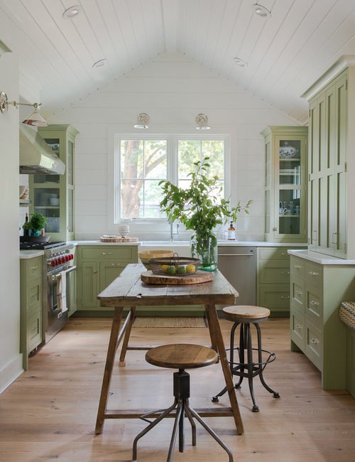 Farmhouse Kitchen with Light Green Cabinets and Shiplap Walls