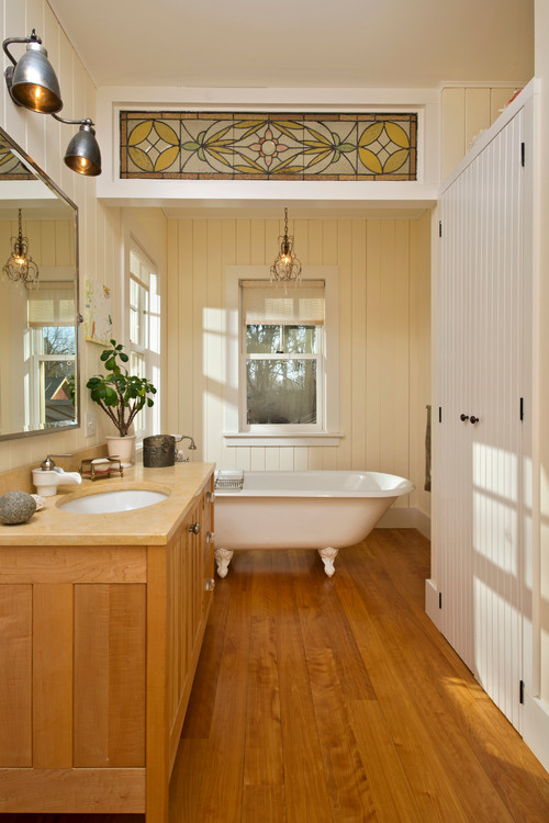 Farmhouse Bathroom with Claw Foot Tub and Stained Glass Art