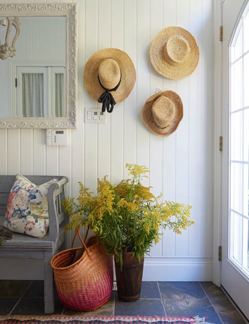 Decorate with hats by putting them on display in an entryway
