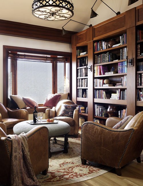 Warm and Cozy Living Room with Leather Furniture and Built-In Bookcase