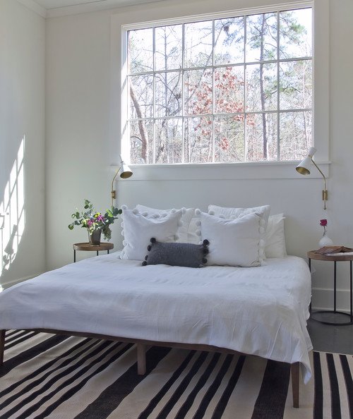White Minimalist Bedroom with Striped Area Rug