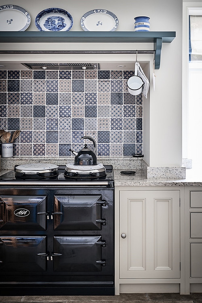 blue and white tiles above vintage kitchen stove