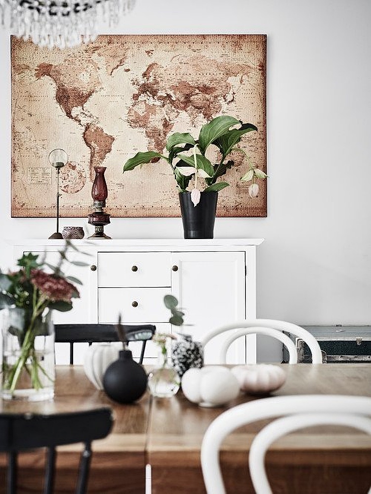 Scandinavian style dining room with wall map