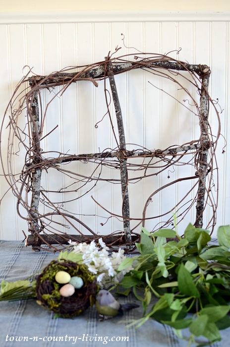 Add grapevine to branches to create a spring wreath
