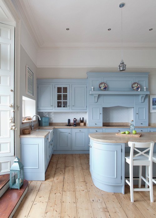 Powder blue kitchen cabinets and natural wood floor