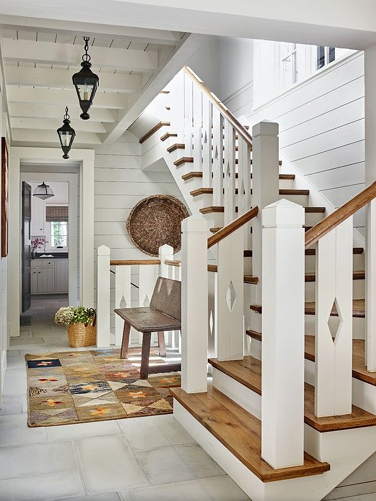 entryway with custom staircase