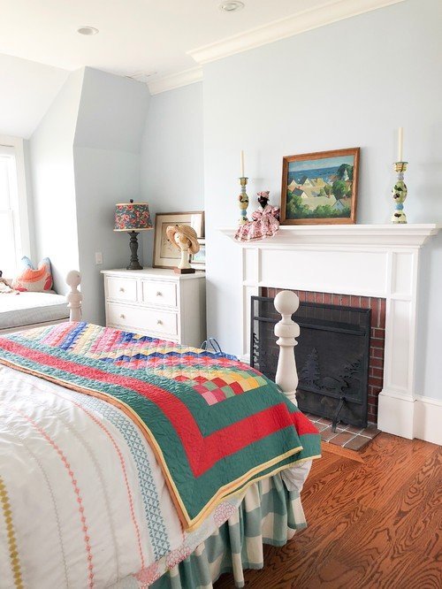 White Cannonball Bed with Colorful Block Quilt