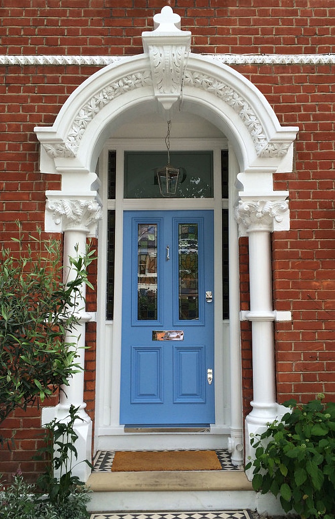 bright blue door on brick house