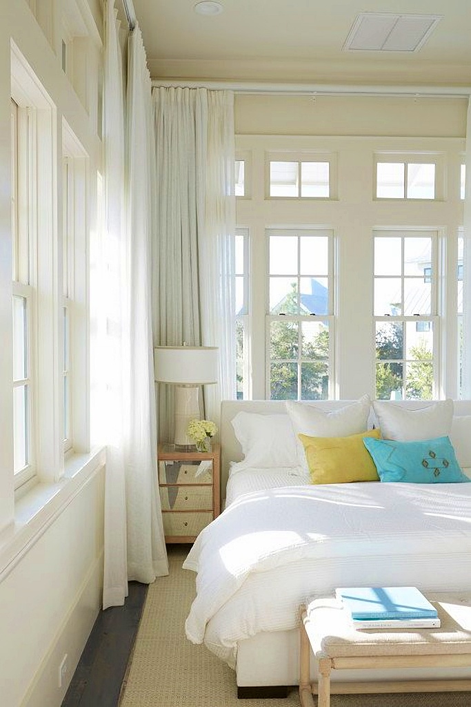 coastal style bedroom with gauzy curtains