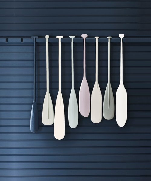 Painted Boat Oars Hanging on Navy Blue Wall