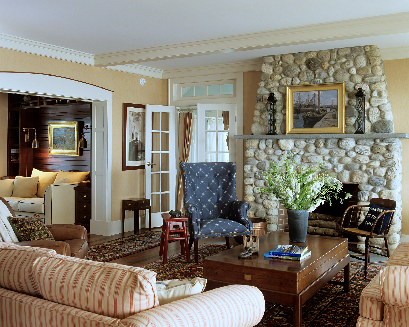 traditional living room with stone fireplace