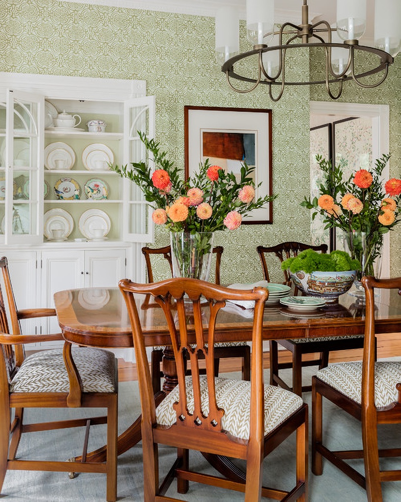 green and white wallpaper in traditional dining room