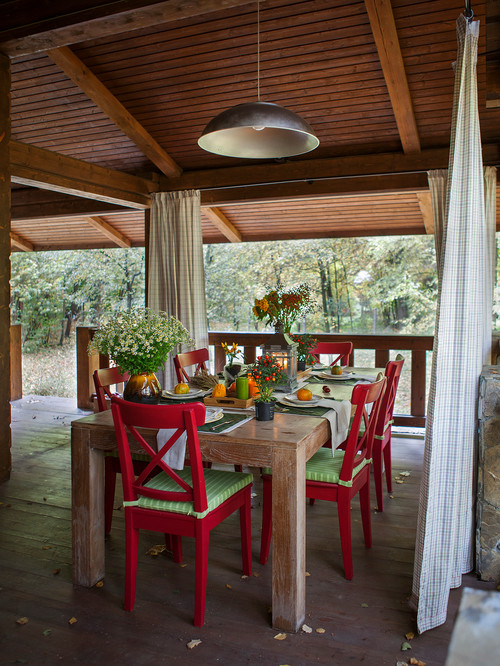 Red Painted Dining Chairs on a Covered Patio