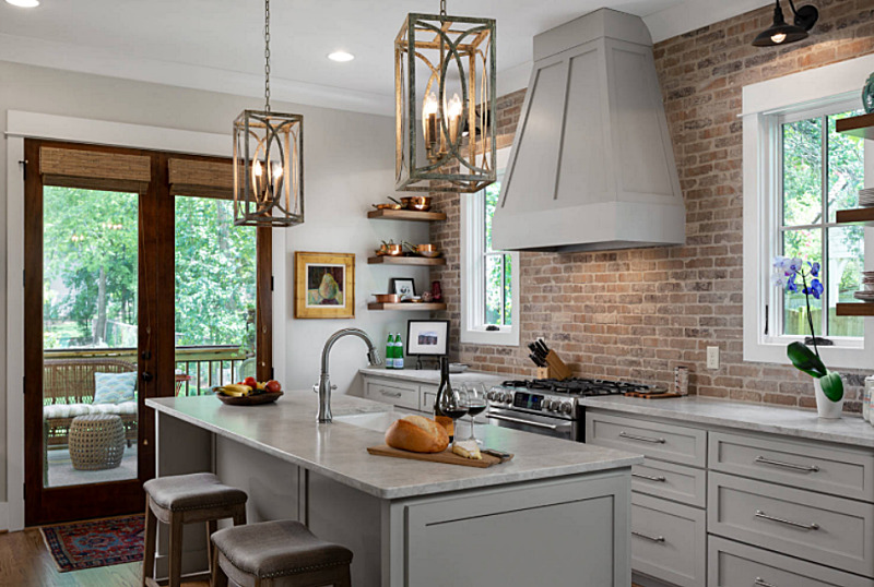 Farmhouse Style Kitchen with Brick Wall and Ample Island