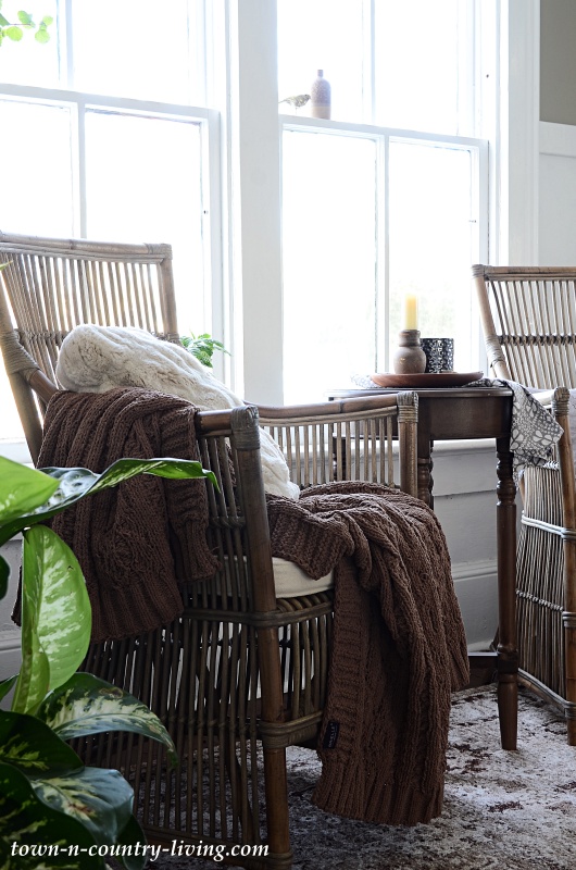 Cozy Entryway with Rattan Chairs and Faux Fur Throws