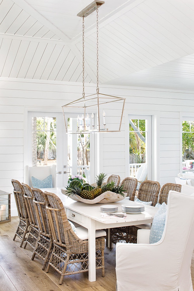 Beach style cottage dining room in white and rattan