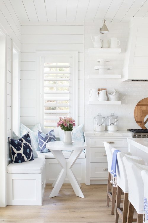 All White Kitchen with Wood Floor and Bread Boards