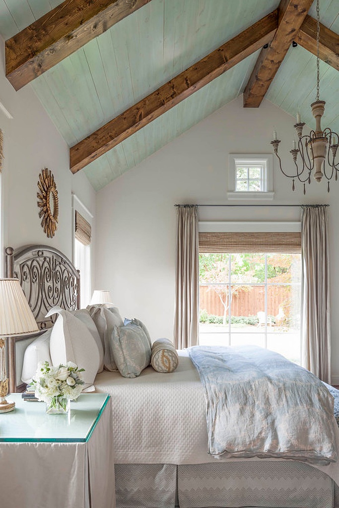 French country style bedroom with vaulted ceiling