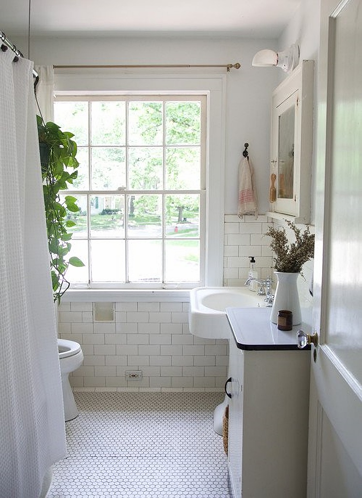 farmhouse style bathroom with penny tile floor