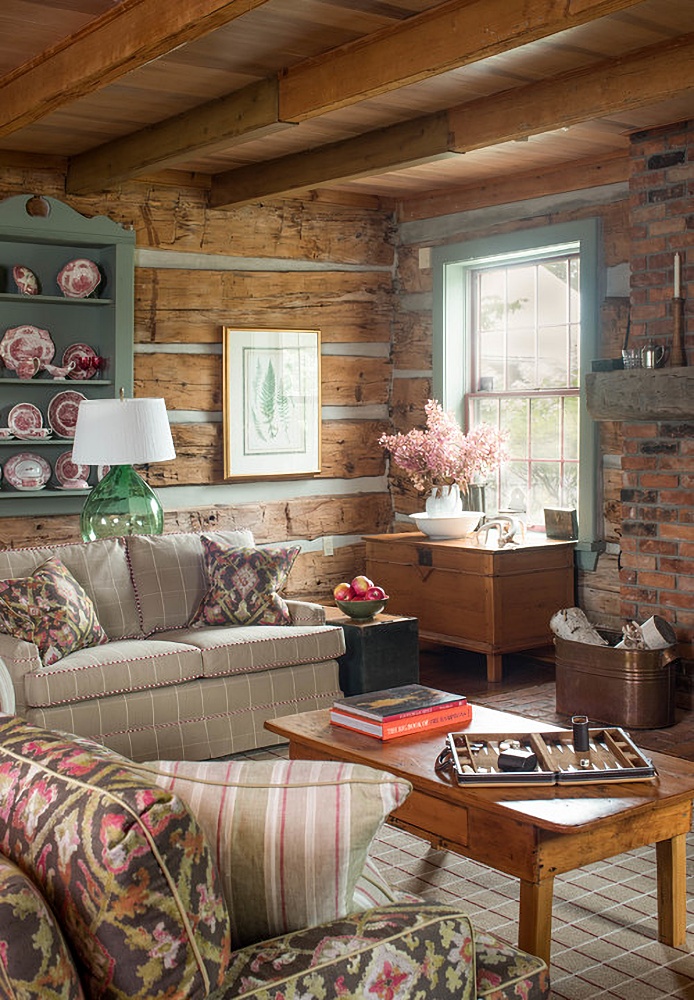 rustic yet feminine living room with rough hewn wood walls