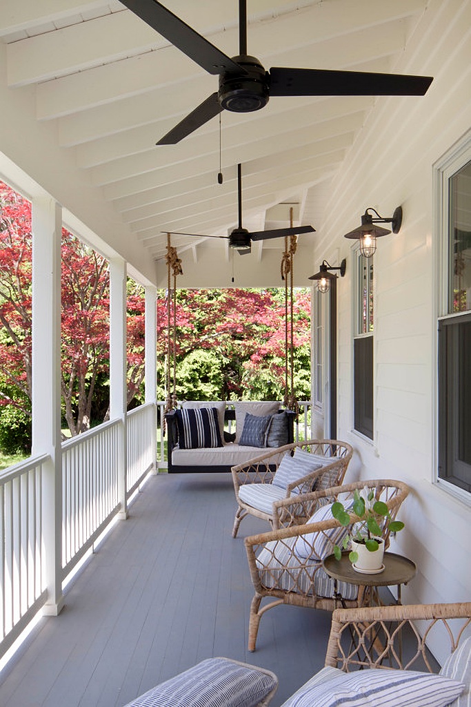 farmhouse porch with swing and ceiling fans