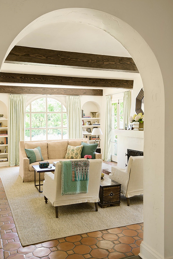 Spanish style living room in neutral tones and aqua accents