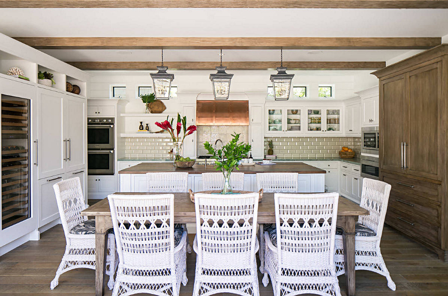Eat In Kitchen with Wood Table and White Wicker Chairs