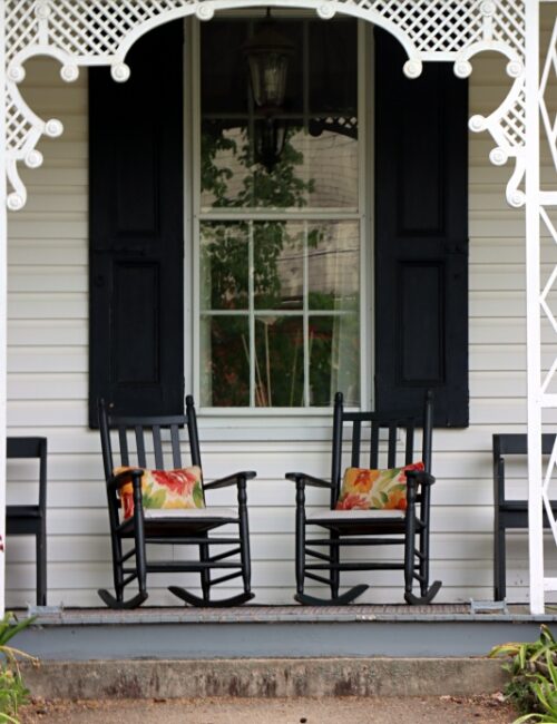 Victorian Porch with Black Rocking Chairs