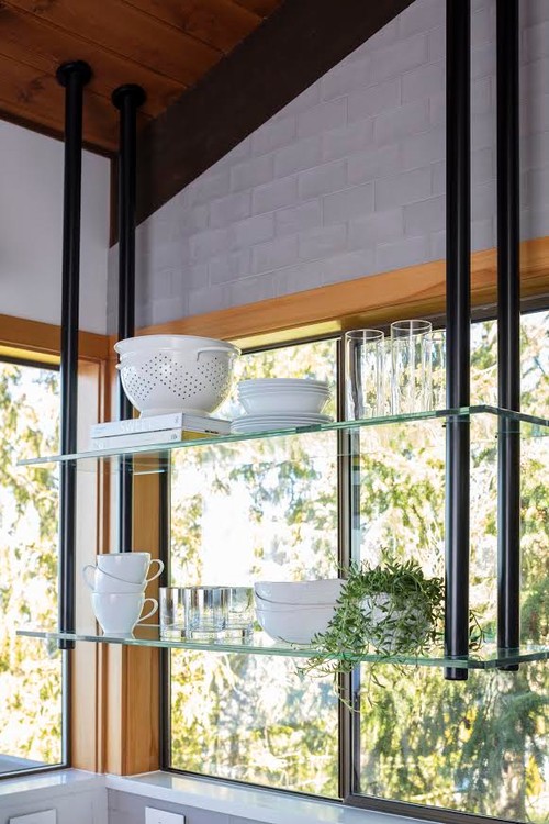 Suspended glass shelves in contemporary style kitchen