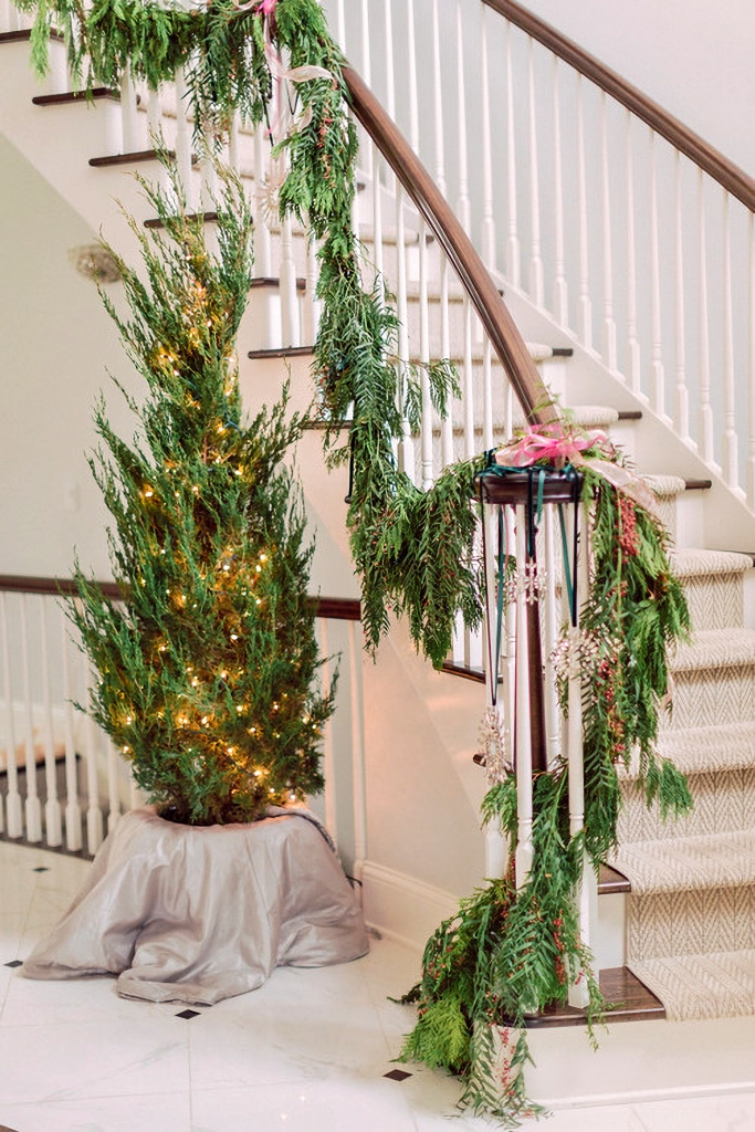 grand staircase decorated with Christmas garland