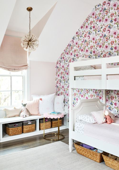 Girls bedroom with floral wallpaper and white bunk beds