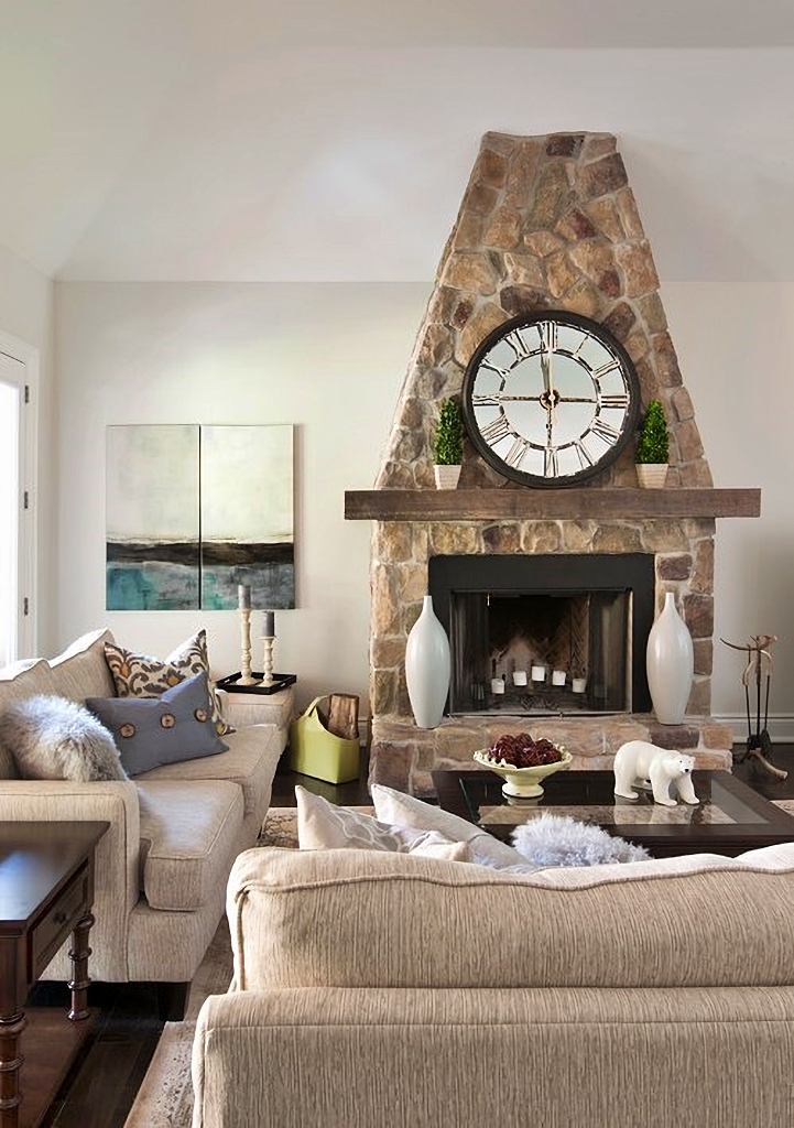 rustic living room with stone fireplace
