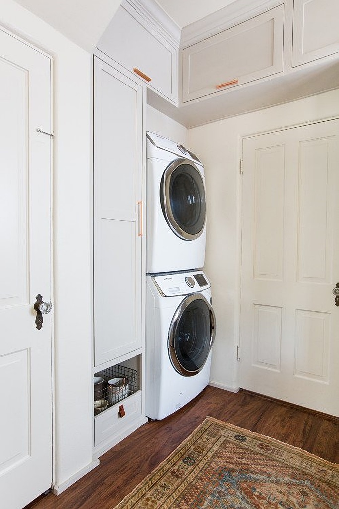 stackable washer and dryer in laundry room
