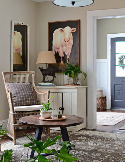 Country Style Sitting Room with Large Cow Painting